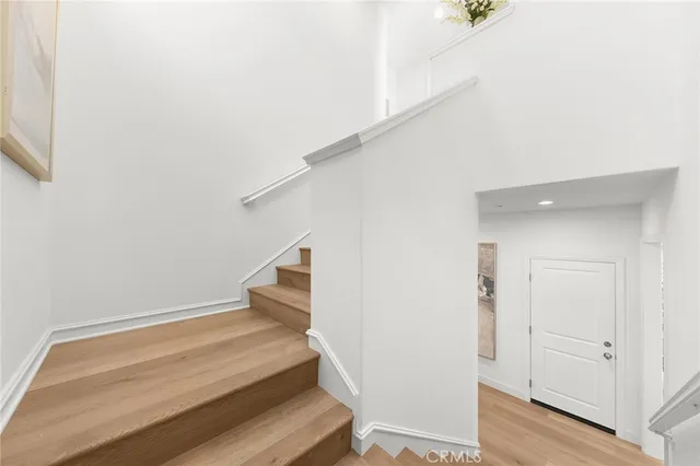 a bedroom with a bed couch and window