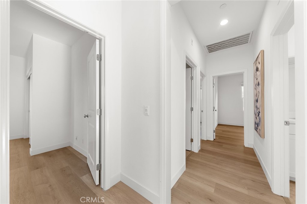112 Velvetleaf Irvine, CA 92620 - Photo 27 of 51 a view of a hallway with wooden floor