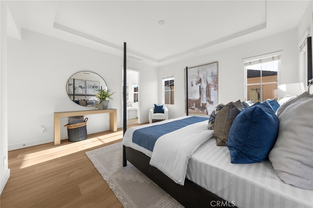 112 Velvetleaf Irvine, CA 92620 - Photo 30 of 51 a spacious bedroom with a bed a fireplace and windows