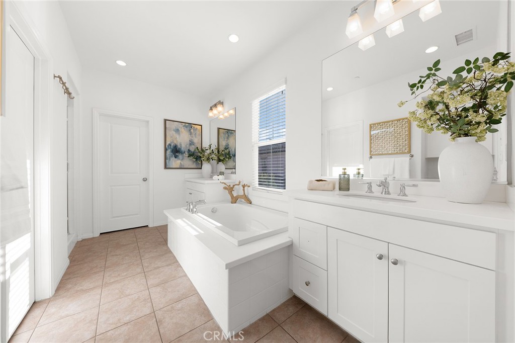 112 Velvetleaf Irvine, CA 92620 - Photo 32 of 51 a spacious bathroom with a sink and mirror