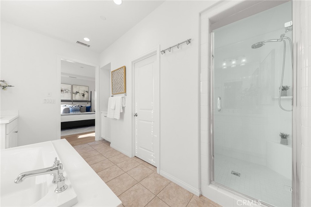 112 Velvetleaf Irvine, CA 92620 - Photo 34 of 51 a bathroom with a bathtub shower sink and mirror