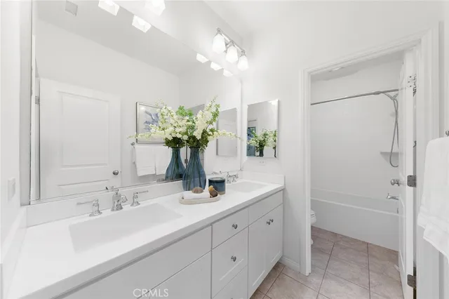 a building outdoor space with patio furniture and potted plants