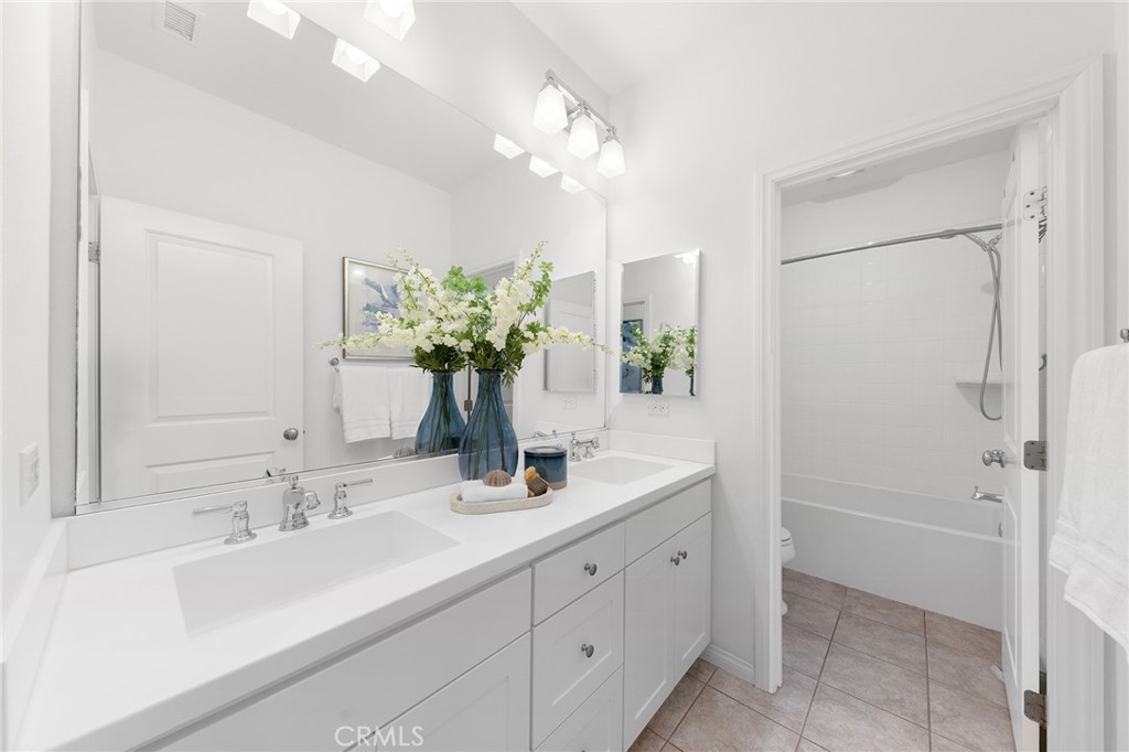 112 Velvetleaf Irvine, CA 92620 - Photo 40 of 51 a bathroom with a double vanity sink mirror and shower
