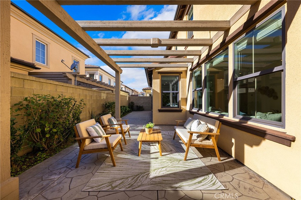 112 Velvetleaf Irvine, CA 92620 - Photo 44 of 51 a building outdoor space with patio furniture and potted plants