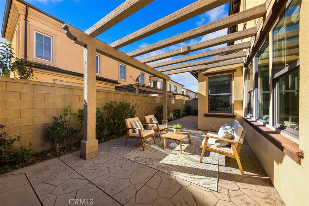 112 Velvetleaf Irvine, CA 92620 - Photo 46 of 51 a building outdoor space with patio furniture and potted plants