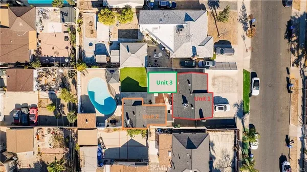 an aerial view of residential houses with outdoor space