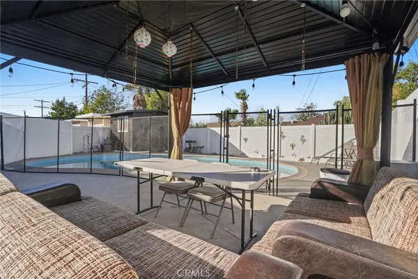 a view of a swimming pool with a patio
