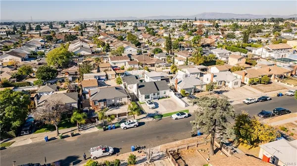 an aerial view of houses with outdoor space