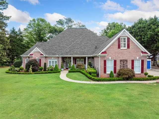 a front view of a house with a yard porch and yard