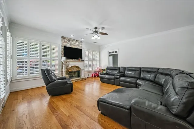 a living room with furniture fireplace and a flat screen tv