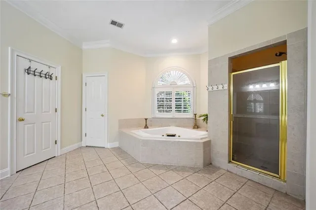 a spacious bathroom with a bathtub and a shower