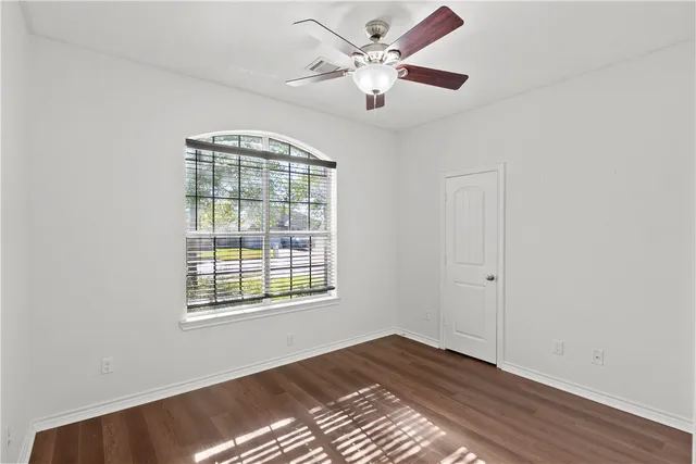 a kitchen with a sink and a wooden cabinets