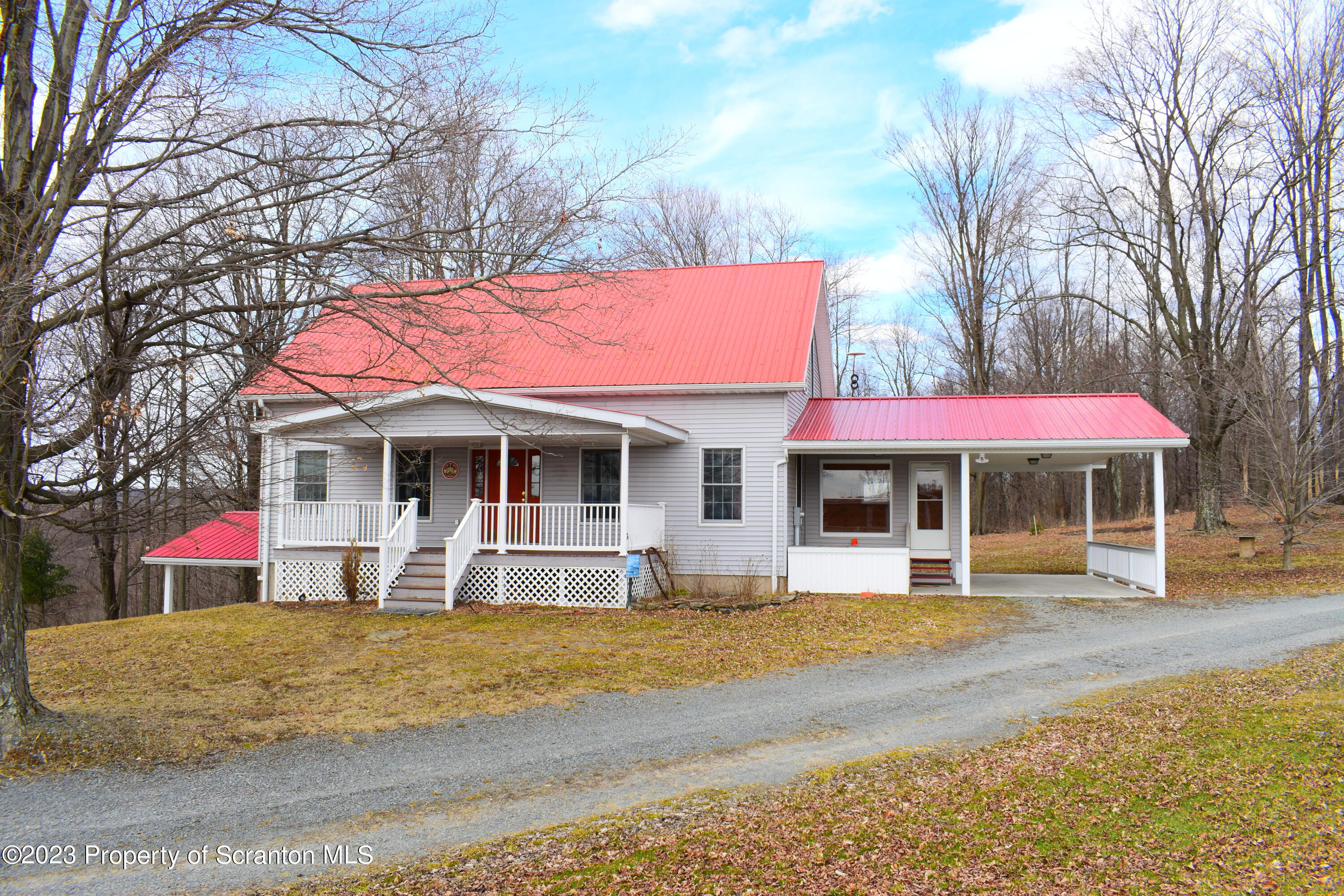 42 South Lott Road Meshoppen, PA 18630 - Photo 1 of 76 a view of a house with a yard and sitting area