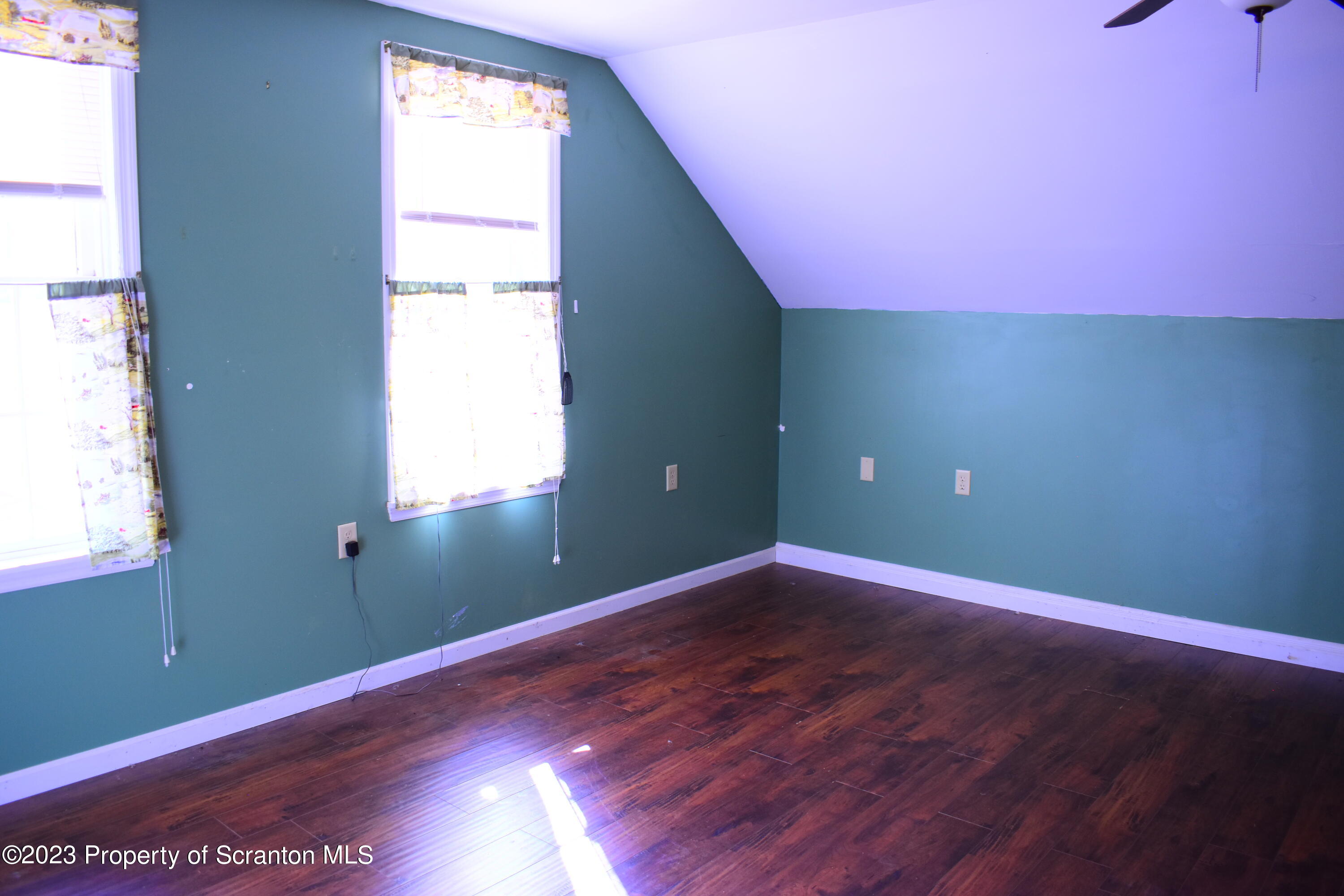 42 South Lott Road Meshoppen, PA 18630 - Photo 27 of 76 an empty room with wooden floor and windows