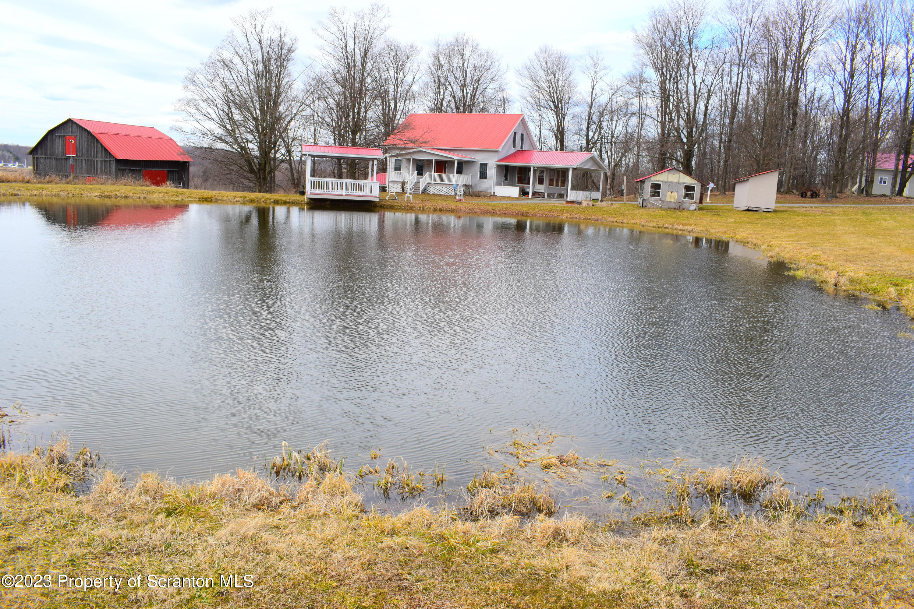 42 South Lott Road Meshoppen, PA 18630 - Photo 3 of 76 a view of a swimming pool with an outdoor space and seating area