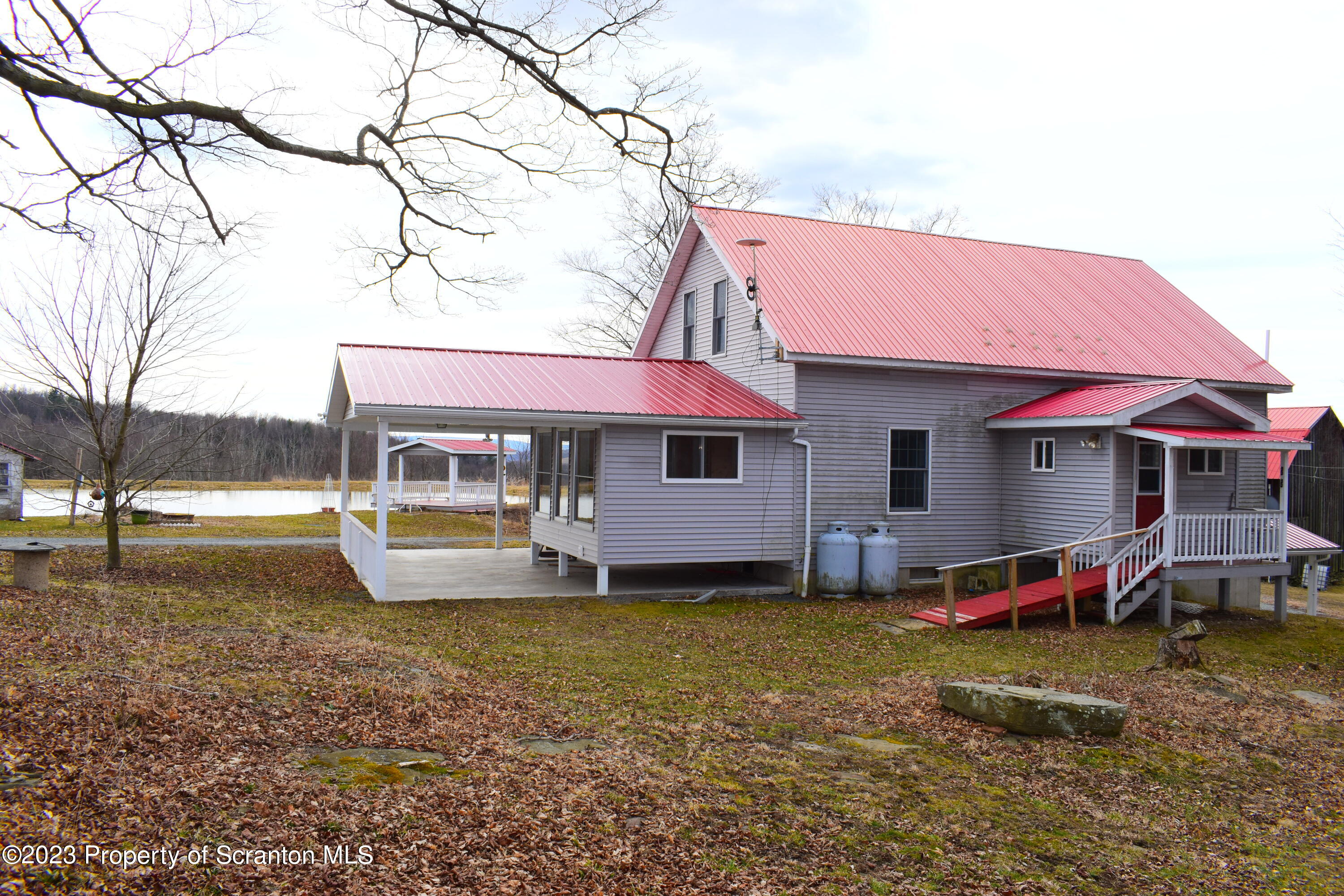 42 South Lott Road Meshoppen, PA 18630 - Photo 50 of 76 a view of a house with backyard porch and sitting area