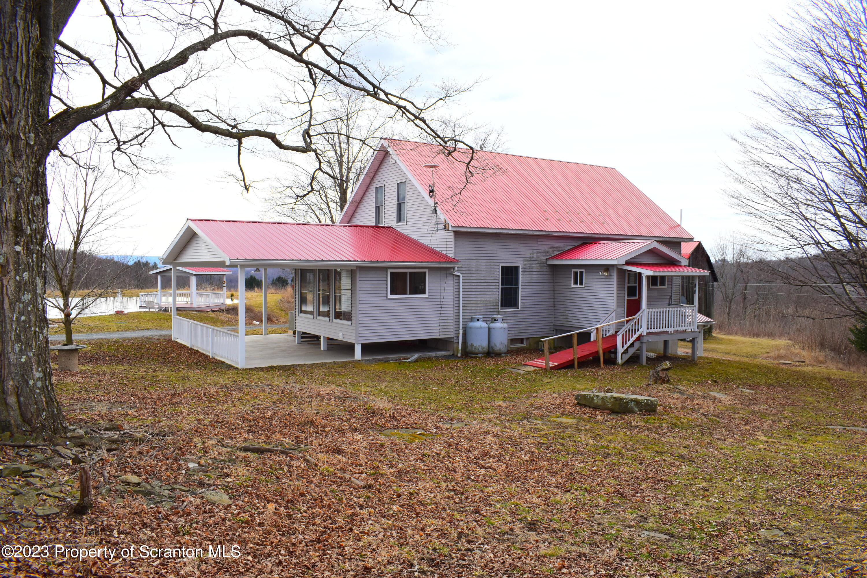 42 South Lott Road Meshoppen, PA 18630 - Photo 53 of 76 a view of a house with backyard and sitting area
