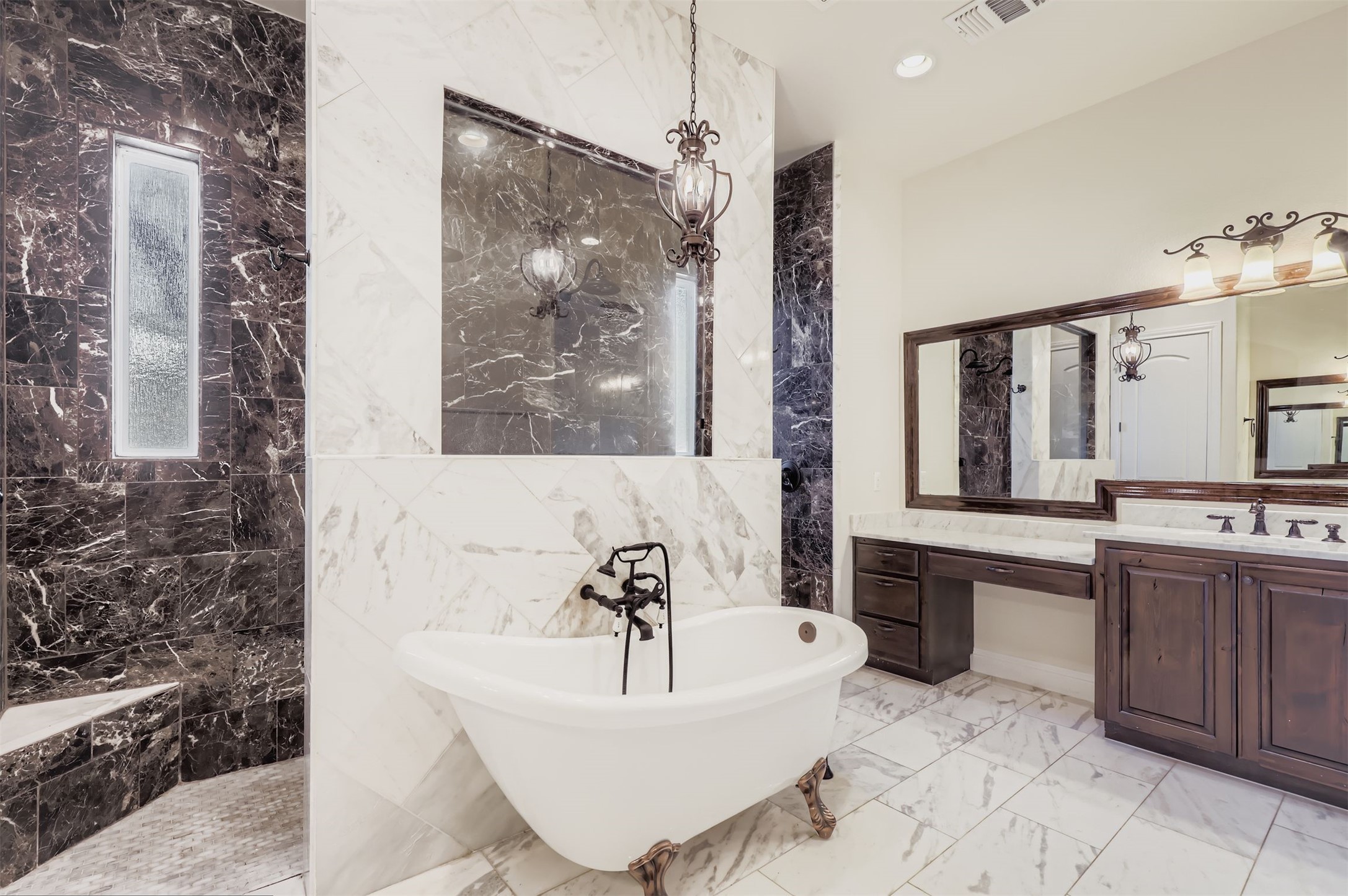 1415 Roaring Fork Leander, TX 78641 - Photo 11 of 39 Full bath with vanity, tile walls, a freestanding bath, light marble finish flooring, and recessed lighting