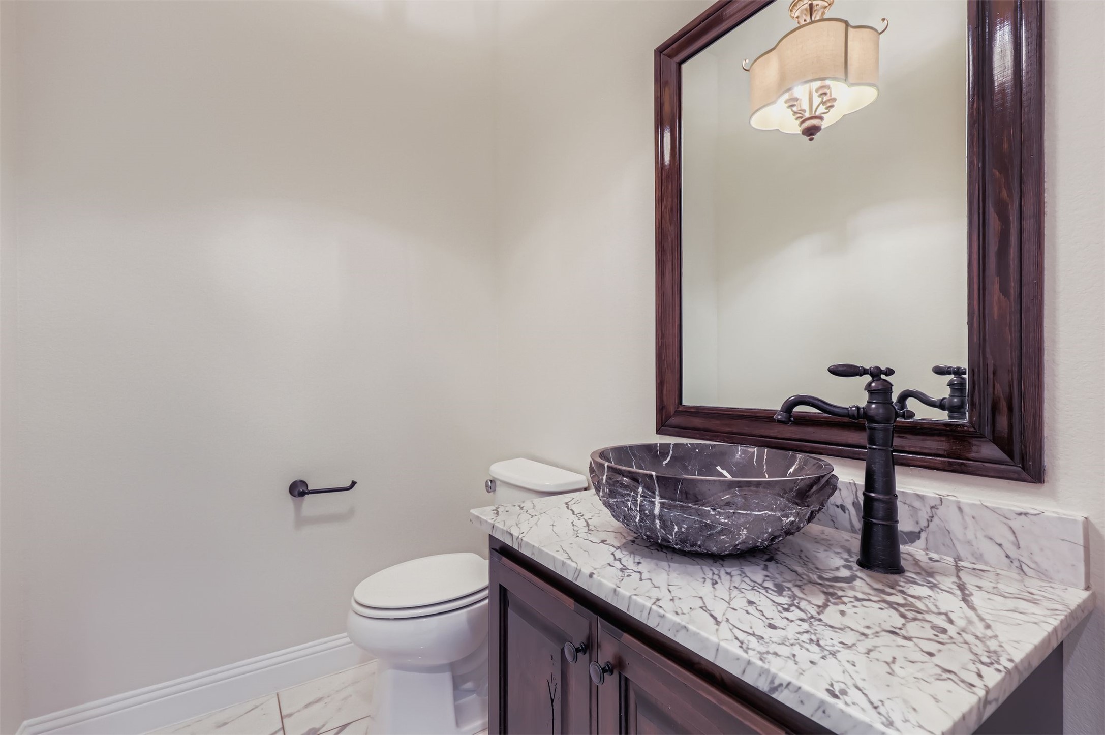 1415 Roaring Fork Leander, TX 78641 - Photo 14 of 39 Half bath featuring vanity and light marble finish flooring