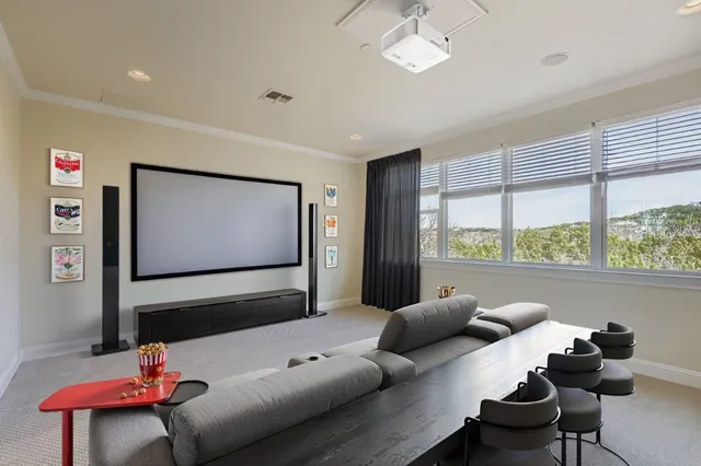 a bedroom with bed couch and window