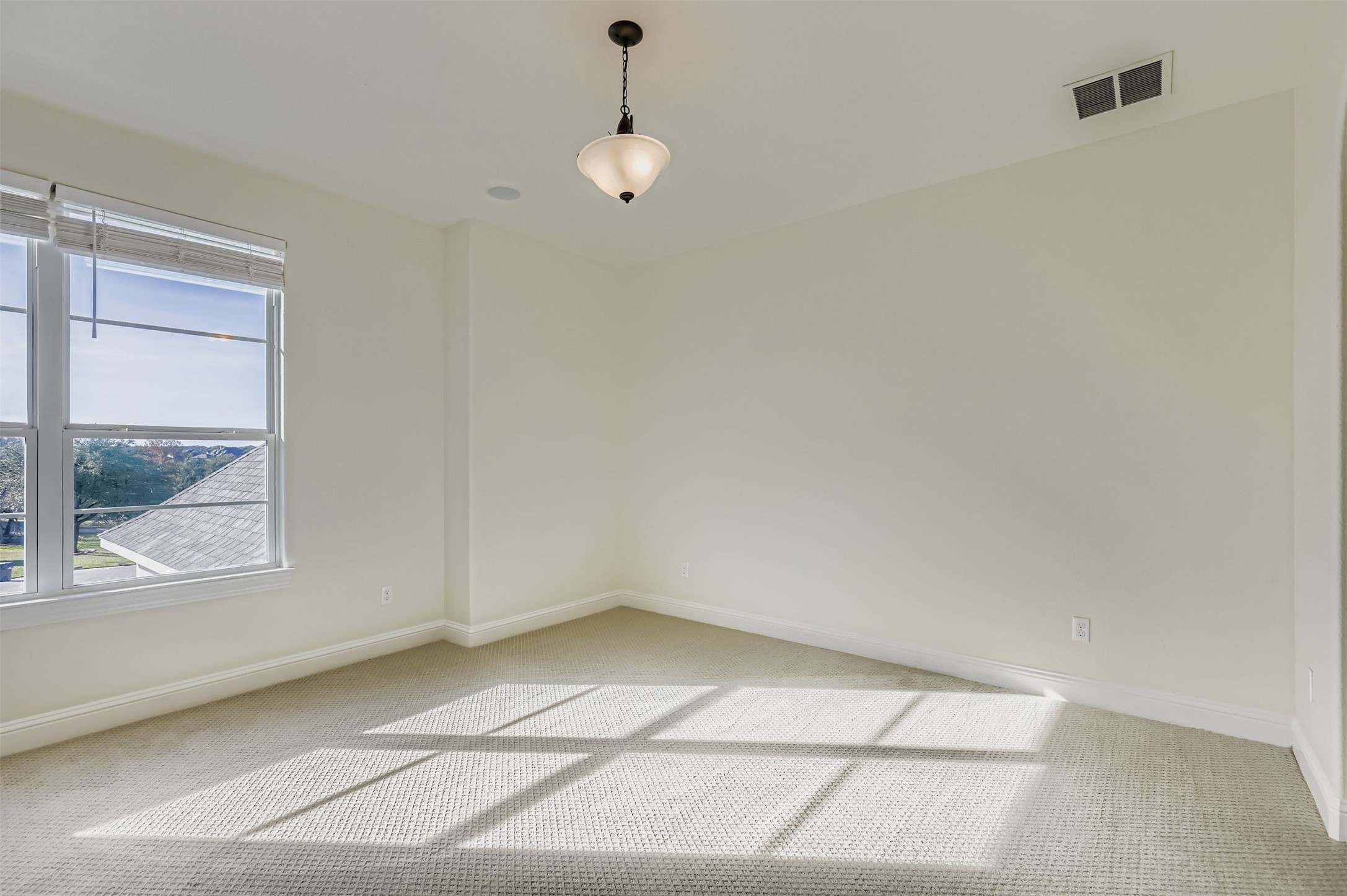 1415 Roaring Fork Leander, TX 78641 - Photo 23 of 39 Unfurnished room featuring baseboards and light carpet