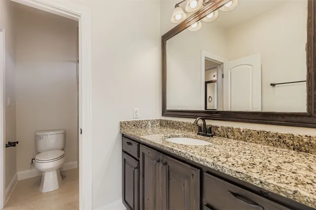 a utility room with sink dryer and washer