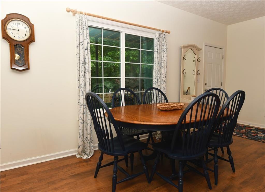 795 Sunset Ridge Lane Southeast Lawrenceville, GA 30045 - Photo 24 of 47 a view of a dining room with furniture window and wooden floor