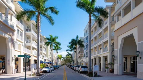 a city street lined with buildings and trees