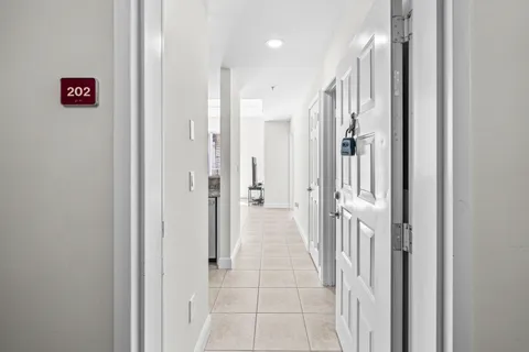 a view of a hallway with a dining area