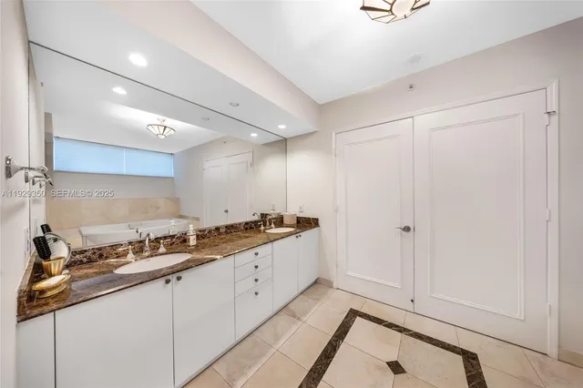 a large bathroom with a sink and a mirror