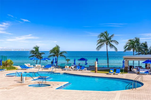 a gym room with furniture and gym equipment