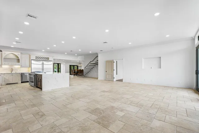a view of a big room with closet and windows