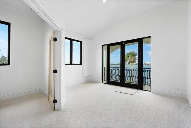 a view of a swimming pool with a garden and plants