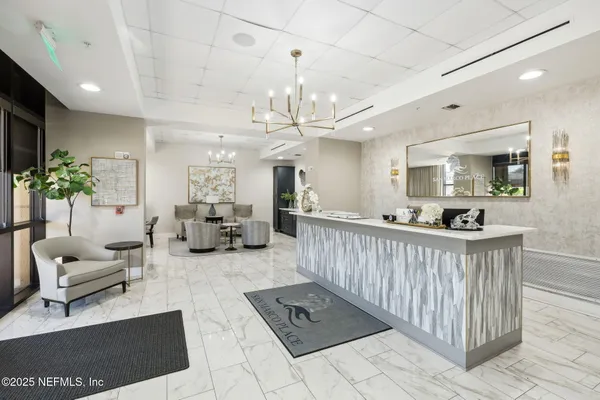 a room with a mirror and vanity