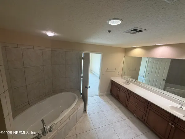 a view of a livingroom and a kitchen