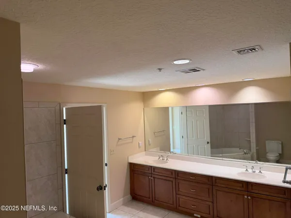 a view of a kitchen and a kitchen with a sink cabinets
