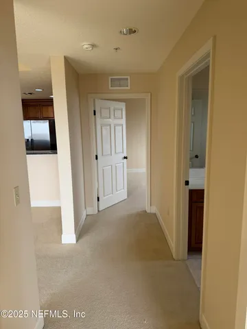 an empty room with closet area