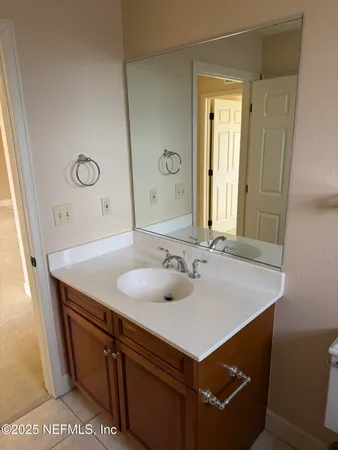 a view of a patio with chairs and umbrellas