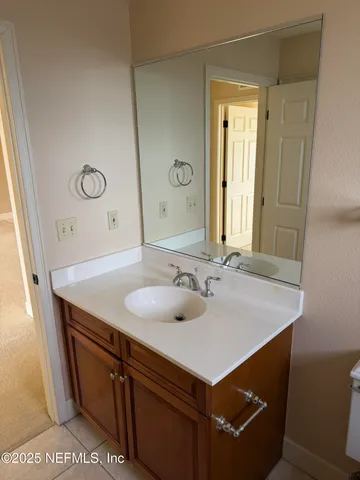 a view of a patio with chairs and umbrellas