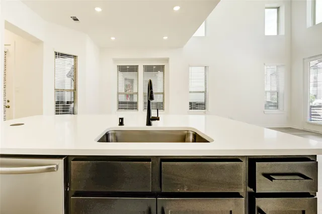 a kitchen with a sink and a window