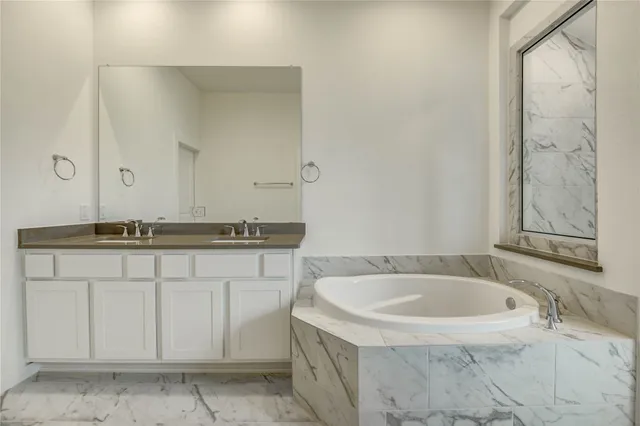 a bathroom with a sink and a bathtub