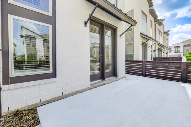 a view of a house with a large window and stairs