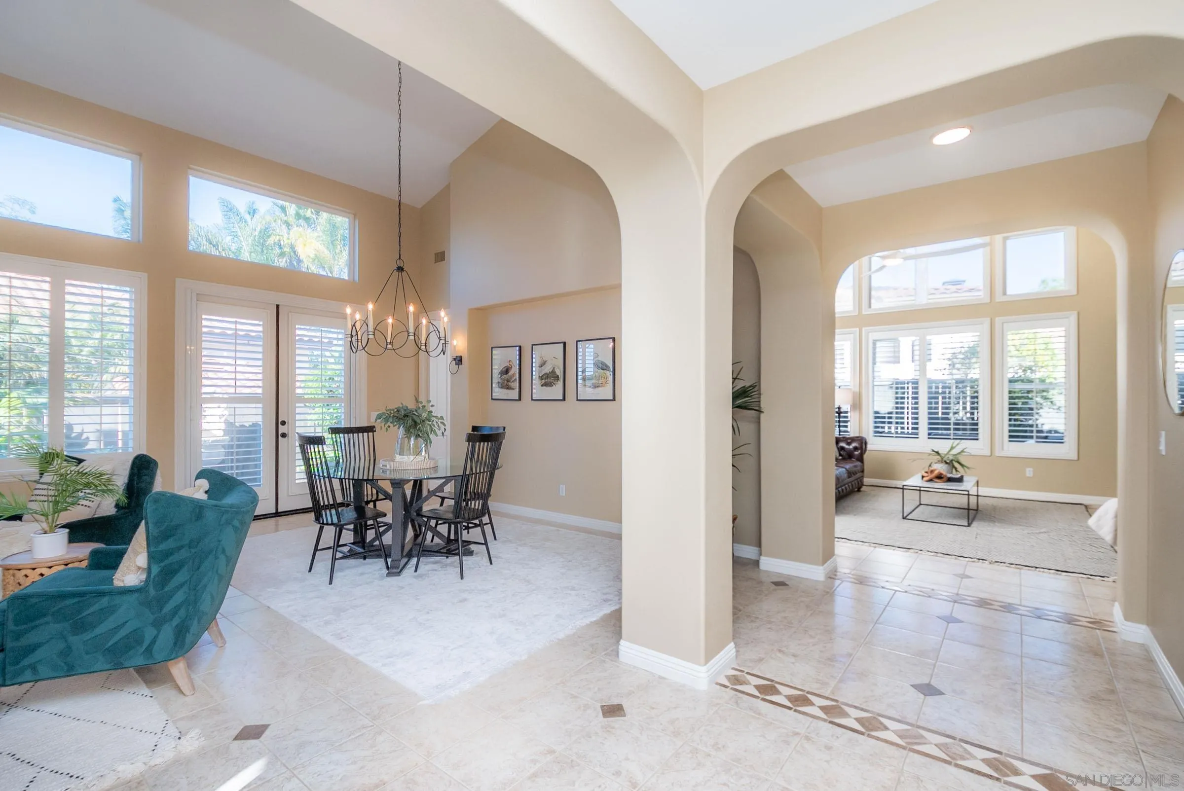 3008 Via Conquistador Carlsbad, CA 92009 - Photo 2 of 31 a dining room with furniture and large windows