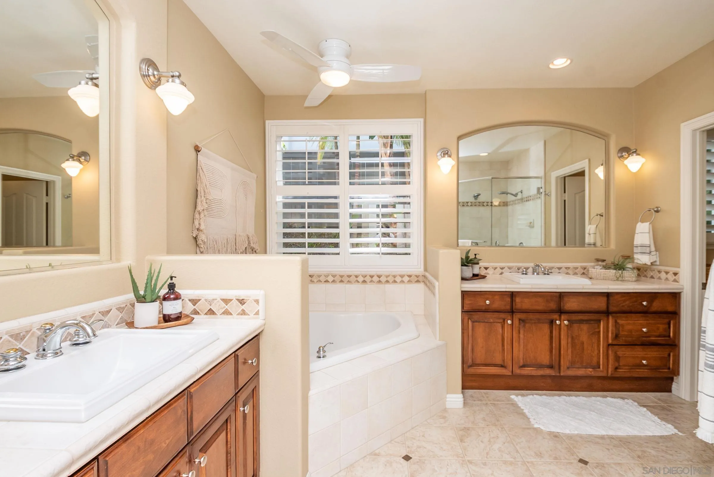 3008 Via Conquistador Carlsbad, CA 92009 - Photo 24 of 31 a bathroom with a tub sink and mirror