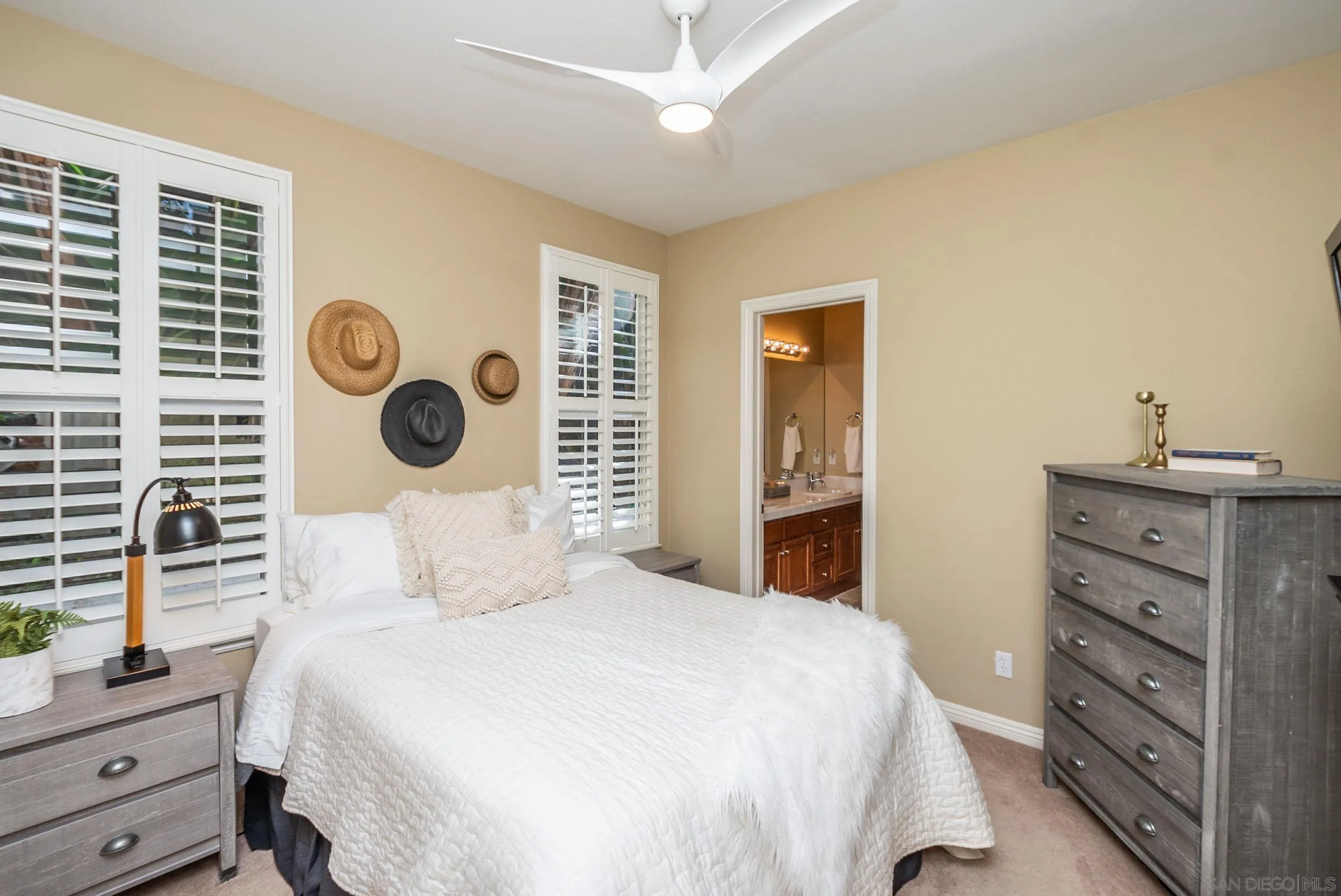 3008 Via Conquistador Carlsbad, CA 92009 - Photo 27 of 31 a bedroom with a bed and a cabinets