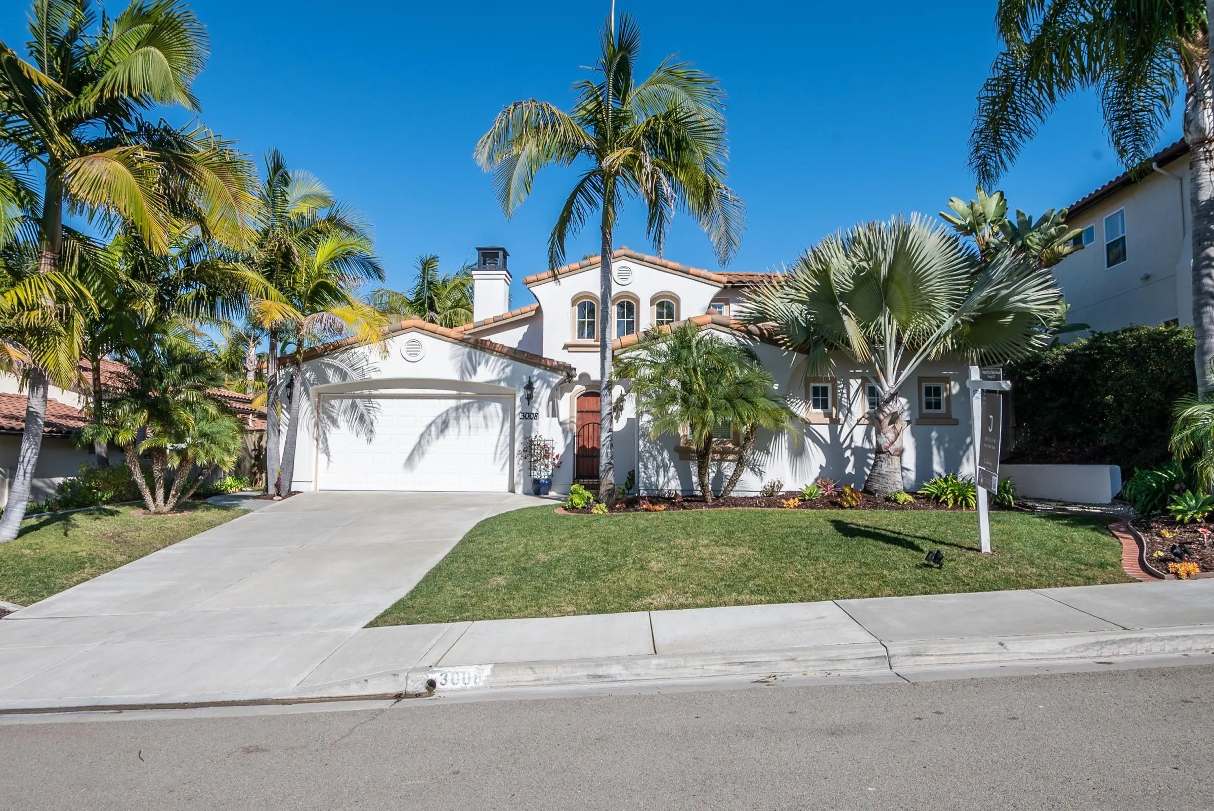 3008 Via Conquistador Carlsbad, CA 92009 - Photo 31 of 31 a palm tree sitting in front of a house with a yard
