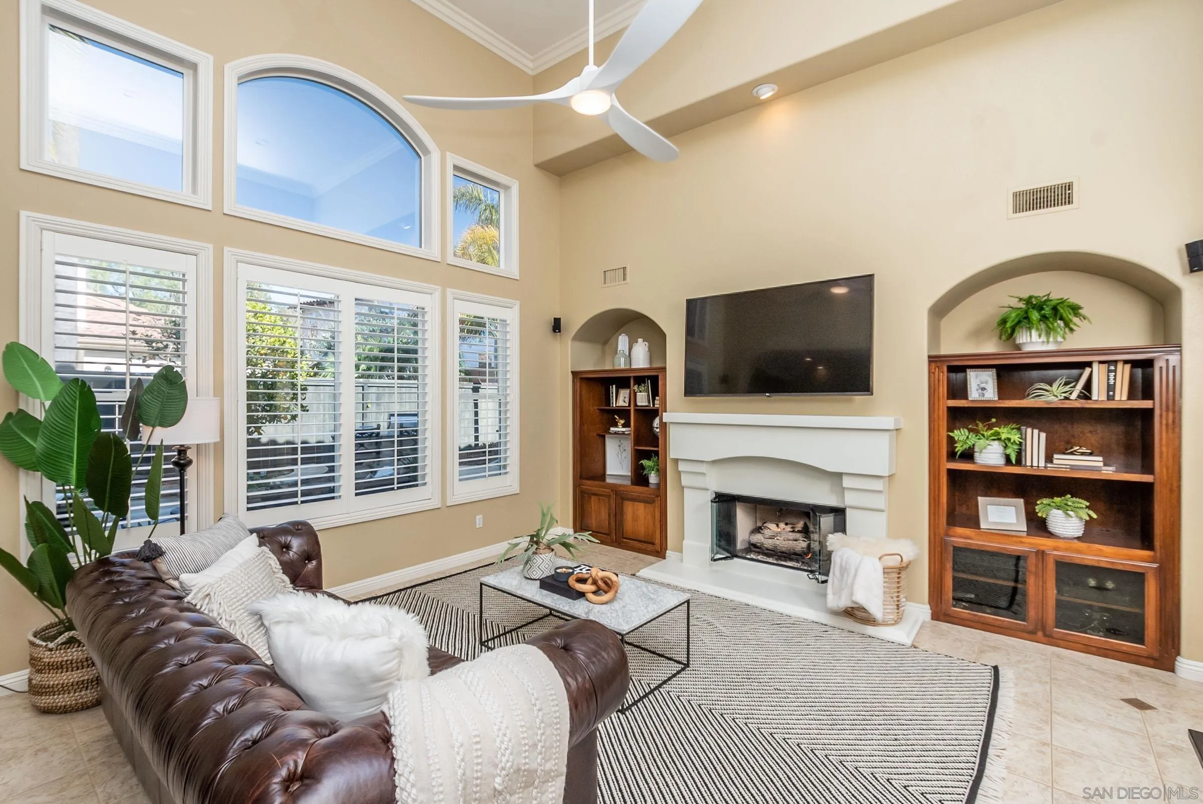 3008 Via Conquistador Carlsbad, CA 92009 - Photo 4 of 31 a living room with furniture a fireplace and a flat screen tv