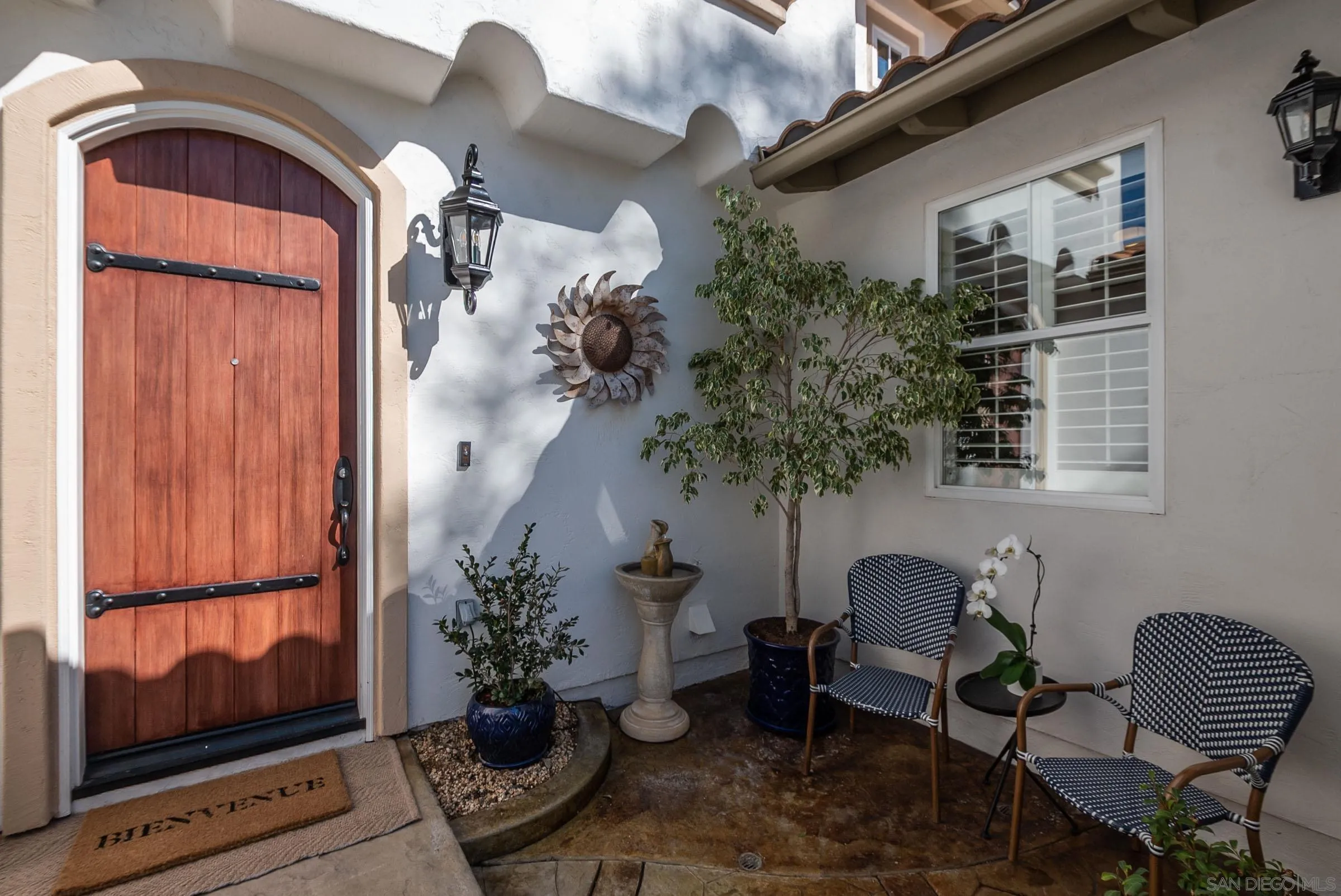 3008 Via Conquistador Carlsbad, CA 92009 - Photo 7 of 31 a potted plant sitting in front of a house