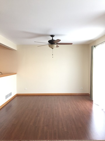 562 Wynbrooke Road Romeoville, IL 60446 - Photo 11 of 24 a view of a room with wooden floor and a window