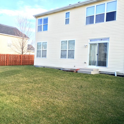562 Wynbrooke Road Romeoville, IL 60446 - Photo 24 of 24 a view of a house with backyard and garden
